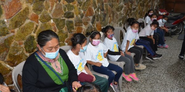 Children wait in the hall to be seen by doctors and dentists during a medical mission trip