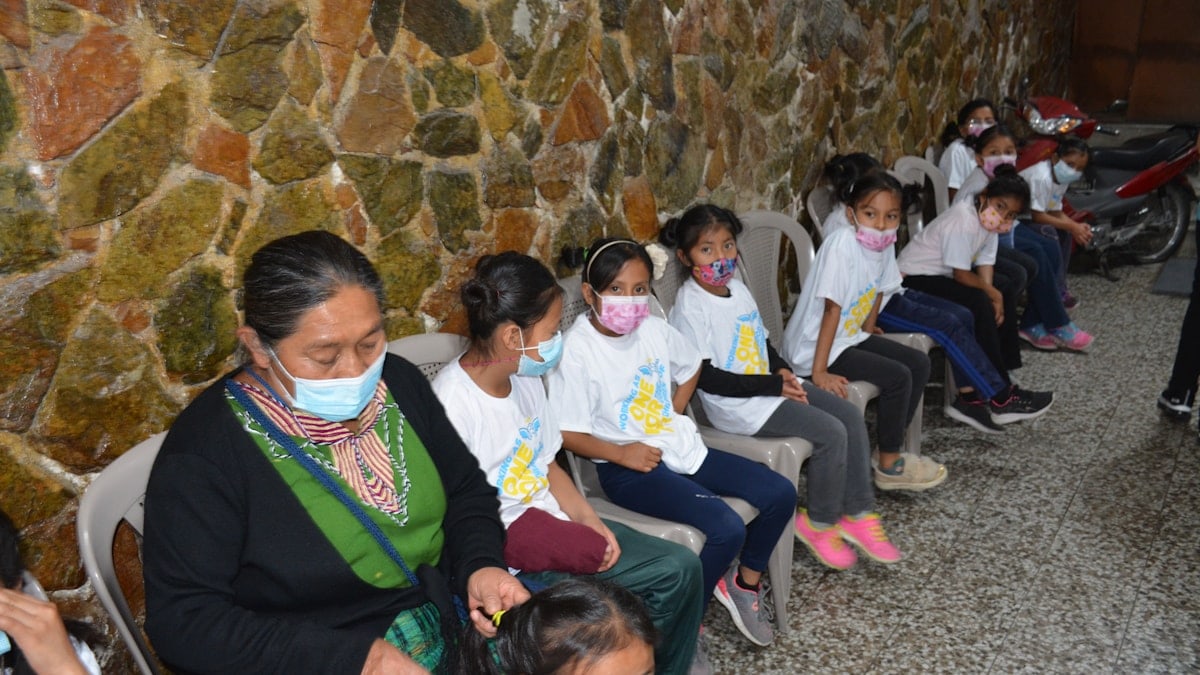Children wait in the hall to be seen by doctors and dentists during a medical mission trip